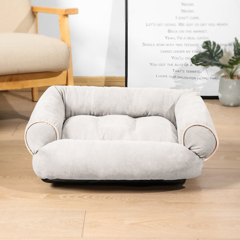 Light gray egg-crate memory foam dog bed with curved sides and soft padded surface