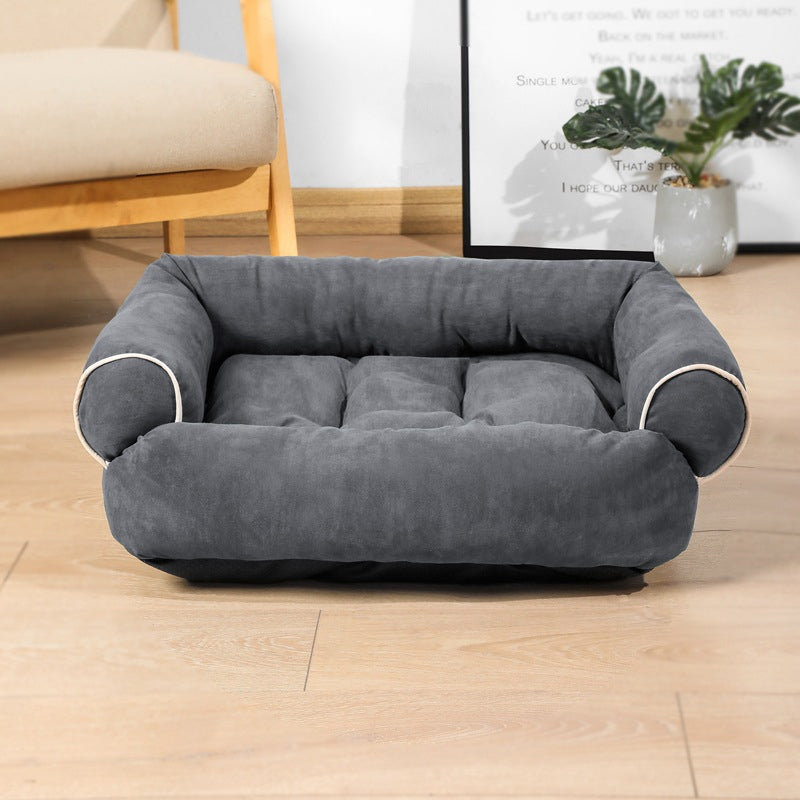 Dark gray egg-crate memory foam dog bed with rounded bolsters and plush inner padding