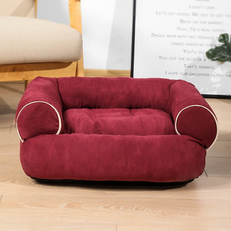 Burgundy egg-crate memory foam dog bed with rounded arms and thick padded base