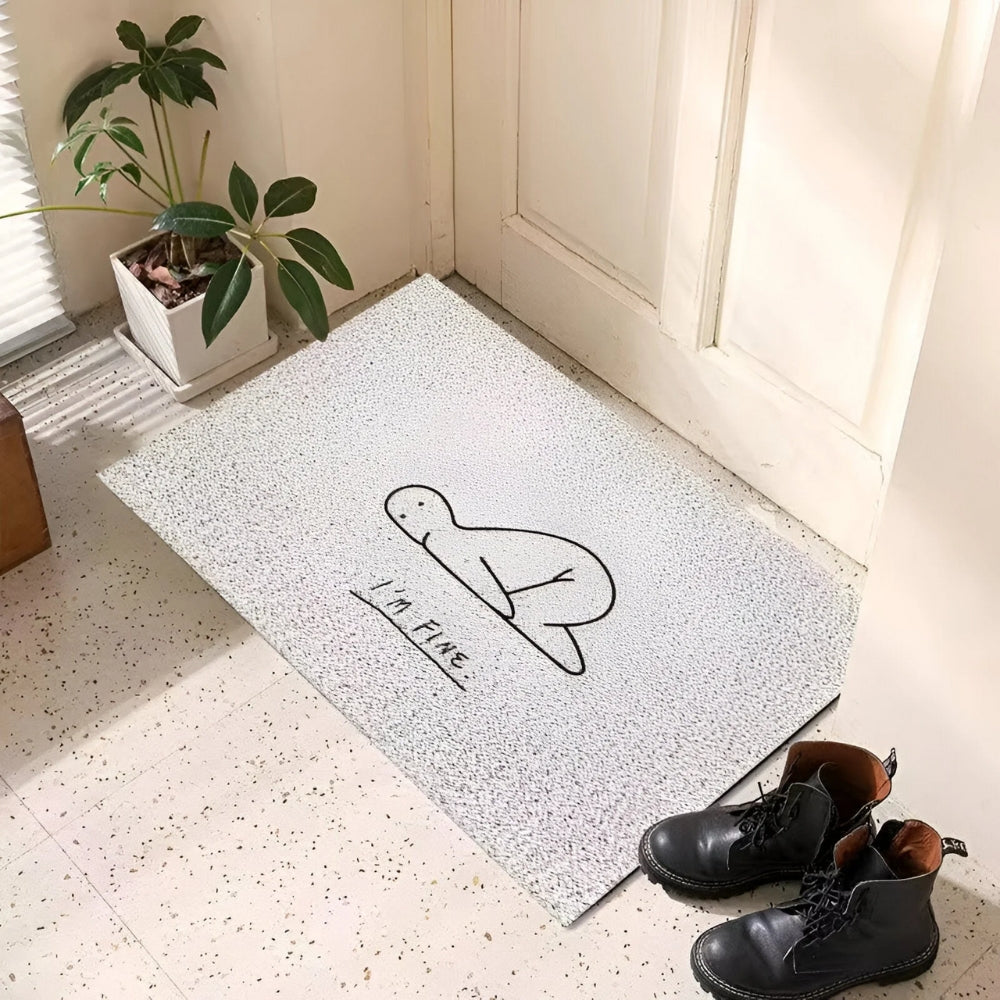 Light gray speckled doormat with black doodle face and small printed text