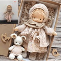 Handmade wool doll in cream hooded knit, floral dress, with white mouse plush