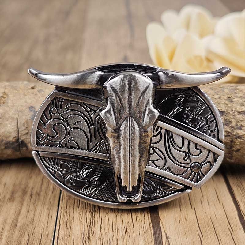 Western belt buckle with large bull skull head centerpiece on oval silver plate