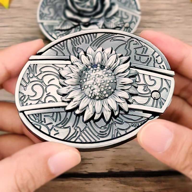 Western belt buckle with engraved sunflower centerpiece in an oval silver frame