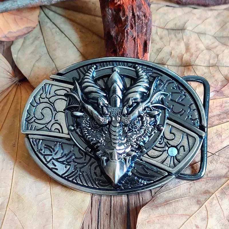 Western oval belt buckle with engraved horned bull skull motif, dark silver-tone metal