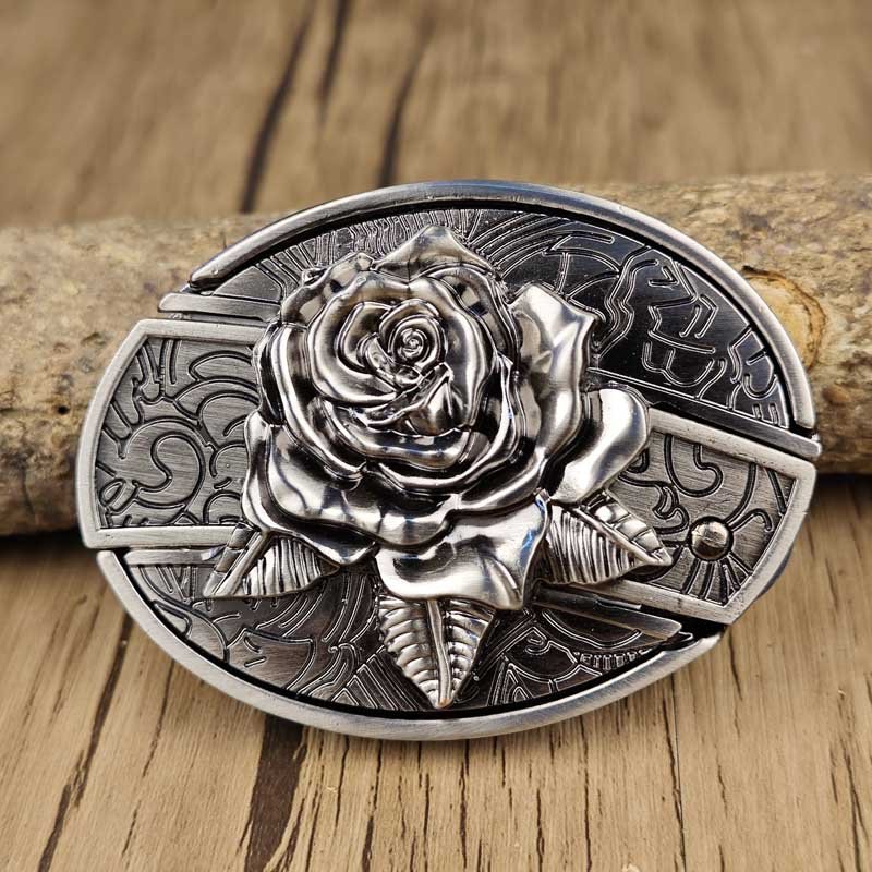 Western belt buckle with engraved rose and bull skull accents on oval silver plate