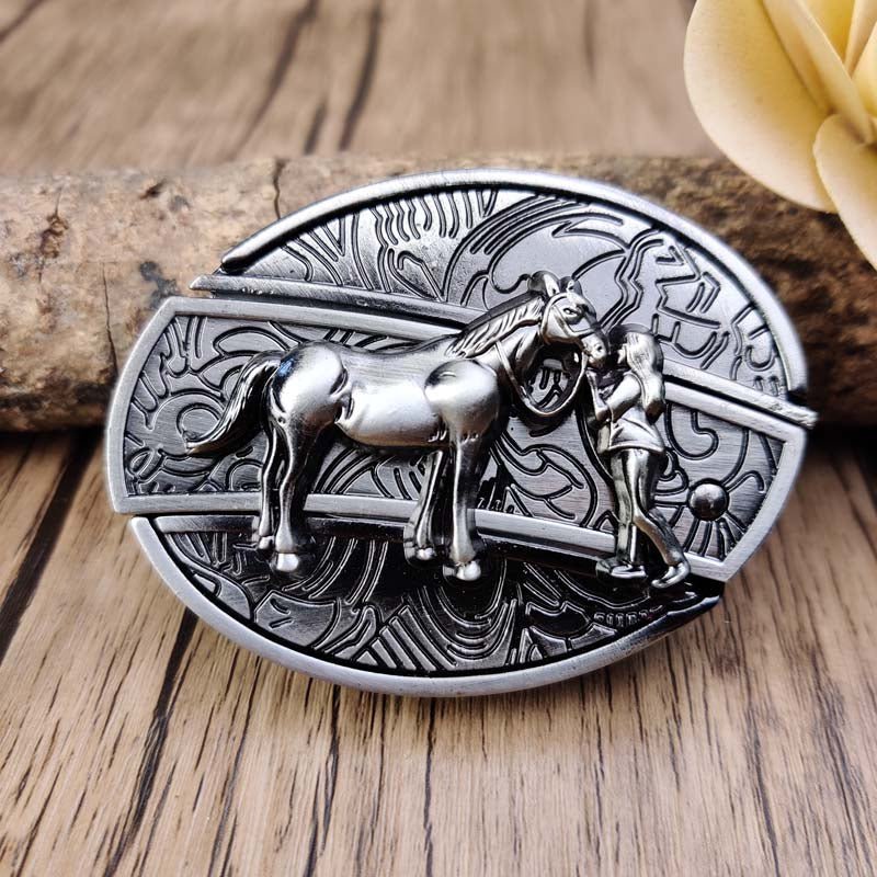 Western oval belt buckle with engraved bull head and filigree border, silver-tone metal