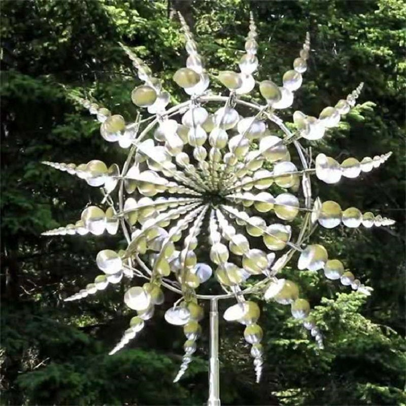 Silver metal wind spinner with dangling disc droplets radiating from a central hub.